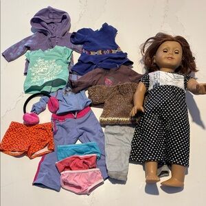 American Girl Authentic Doll Saige and bundle of Authentic clothing.